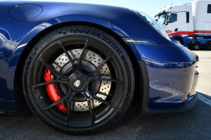 Breaks in alloy wheel of a Porsche 911 GT3 on display